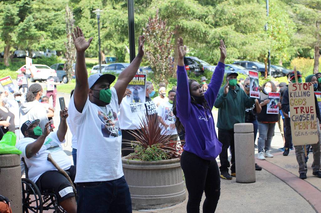 Malik Williams siblings, Marvin Phelps Jr., left and Monique Phelps protest in front of Federal Way City Hall on June 28. Olivia Sullivan/staff photo