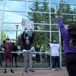 Monique Phelps raises her hands and chants hands up, dont shoot at Federal Way City Hall on June 28. Olivia Sullivan/staff photo