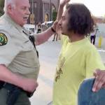 A sheriffs court marshal arrests a man who dangled a doughnut in front of him. (Screen grab from video courtesy of Bennett Haselton)