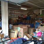 A local Federal Way couple asked for item donations to sell at a garage sale to raise funds for a friend battling cancer. Now, their three-car garage is stacked high with goods to be sold. Courtesy photo