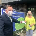 Todd Keeney, president of the Federal Way Washington Stake of the Church of Jesus Christ of Latter-day Saints, presents a check towards diapers for FWPS families to Laura Batcheller, ECEAP/Head Start (ESTART) program manager​ of Federal Way Public Schools. Courtesy photo