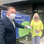 Todd Keeney, president of the Federal Way Washington Stake of the Church of Jesus Christ of Latter-day Saints, presents a check towards diapers for FWPS families to Laura Batcheller, ECEAP/Head Start (ESTART) program manager​ of Federal Way Public Schools. Courtesy photo
