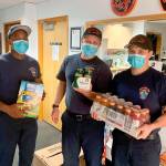 Lt. Walter Hanks, firefighter Christopher Hing, and firefighter Jake Linde accept donations at Station 62 on Sept. 12. Photo courtesy of Shelley Pauls