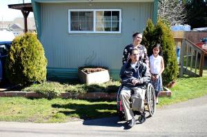 Haley Donwerth/staff photoThe Barco family returns to their Des Moines home for the first time since Bernardo, front, lost his left leg and right arm in a motorcycle crash in December 2018. The Federal Way Mirrors report on Bernardo Barcos recovery was honored with a first place award for general feature by the Washington Newspaper Publishers Association 2020 Better Newspaper Contest.