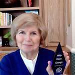 Jeanne Burbidge poses with her Help, Hope, Change award. Courtesy photo