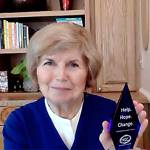 Jeanne Burbidge poses with her Help, Hope, Change award. Courtesy photo