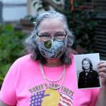 Torry Hemmert holds a photo of herself taken while she was in the army while wearing one of her handmade masks. Photo courtesy of her son, Jon Hemmert