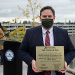 Mayor Jim Ferrell holds the time capsule plaque on Nov. 6. Olivia Sullivan/the Mirror