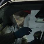 Jordan Barrett of South King Fire administers a COVID-19 nasopharyngeal swab test in Federal Way on Nov. 18. Olivia Sullivan/the Mirror