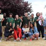 Olivia Sullivan/staff photo
Graduates of the Credible Messenger Green Hill School pilot program, in green polos, proudly celebrate with the programs mentors after the ceremony on Friday, June 21, 2019. Progress Pushers Founder Eddie Purpose is pictured second from left.