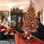 South King Fire Capt. Brad Chaney visits with Santa in Federal Way. Photo courtesy of SKFR