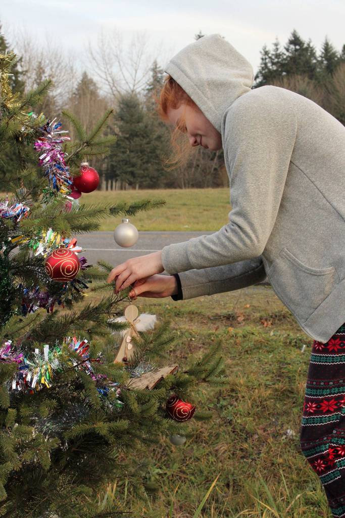 Savannah Allen hangs an ornament on Dec. 10. Photo by Andy Hobbs