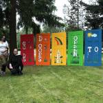 Local artists (pictured left to right) Leann Realiza, Diane Jones Smith and Nici Anderson on June 26 at Wayside United Church of Christ to celebrate the rebuilding of Pride Doors that had been destroyed by vandals the week before. Olivia Sullivan/staff photo