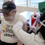 Albert Veveris, 90, receives his first dose of a COVID-19 vaccination on Jan. 26 at Village Green Retirement Campus in Federal Way. Olivia Sullivan/the Mirror