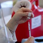 A CVS pharmacist prepares a shot of the Pfizer-BioNTech COVID-19 vaccine on Jan. 26 in Federal Way. Olivia Sullivan/the Mirror