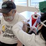 Albert Veveris, 90, receives his first dose of a COVID-19 vaccination on Jan. 26 at Village Green Retirement Campus in Federal Way. Olivia Sullivan/the Mirror