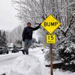 Nine-year-old Aarron Schild stands on top of a massive snowball in Federal Way during last weekends snowstorm. Photo courtesy of Kari Sandstrom Schild
