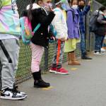 Students line up about six feet apart outside of Panther Lake Elementary for the first day of in-person learning on March 15. Olivia Sullivan/the Mirror