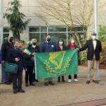 Community members and city officials gather at a St. Patricks Day celebration on March 17 outside City Hall. Olivia Sullivan/the Mirror