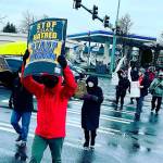 Supporters hold signs at the Stop Asian Hate rally in Federal Way on March 21. Photo courtesy of Allison Fine