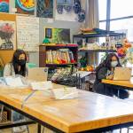 Photos courtesy of Federal Way Public Schools
Left, two Decatur High School students work in class on the first day of school, April 19. Right, a student smiles from behind a mask on the first day of school on April 1.