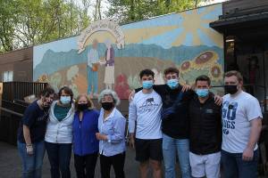 Kae Lee, fourth from left, stands for a photo with volunteers at the food bank on April 29. Olivia Sullivan/the Mirror