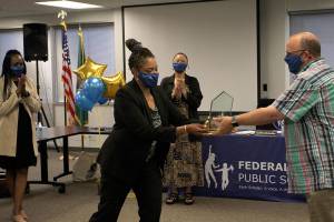 Board President Geoffery McAnalloy presents the inaugural Dream Maker Award to Dr. Tammy Campbell on June 8. Olivia Sullivan/the Mirror
