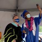 Tajhgee Haskins snaps a quick selfie with Federal Way Principal Matt Oberst on stage on June 10. Olivia Sullivan/the Mirror