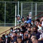 A family holds signs in support of their graduate on June 12. Olivia Sullivan/the Mirror