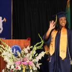 A Decatur graduate waves to her family in the crowd on June 12. Olivia Sullivan/the Mirror