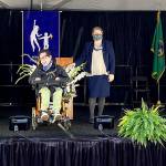 Photo courtesy of Federal Way Public Schools
An Employment and Transition Program graduate smiles on stage at commencement.