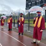 Photo courtesy of Federal Way Public Schools
Thomas Jefferson High School graduates brave the rain before their ceremony.