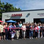 Elected officials, FUSION staff and volunteers, and community members celebrate the grand opening of Poverty Bay Cafe under FUSIONs ownership on Saturday, June 19. Olivia Sullivan/the Mirror
