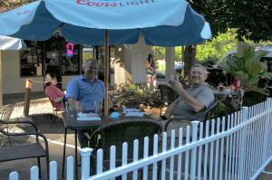 Federal Way residents Kevin Jochim, left, and Steve Reichel enjoy drinks on the new patio area at JPs Tavern on Aug. 5, 2020. Restaurants and bars embraced outdoor seating during the pandemic. File photo