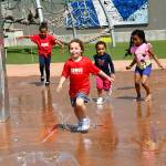 Kids played in the fountain at Town Square Park to cool off on July 10. Photo courtesy of Shelley Pauls