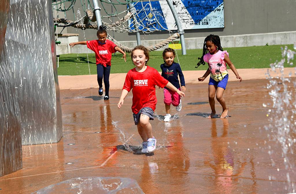 Kids played in the fountain at Town Square Park to cool off on July 10. Photo courtesy of Shelley Pauls