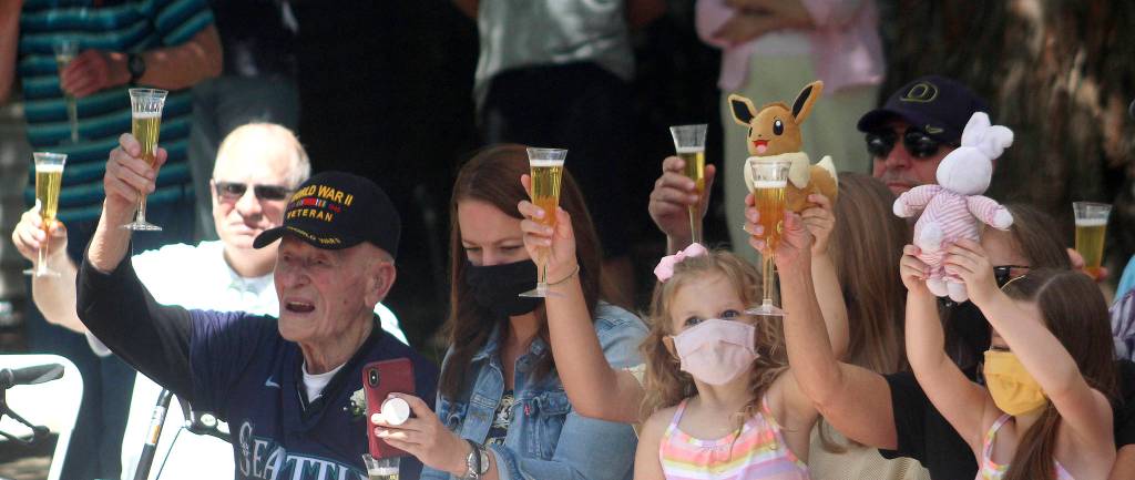 Olivia Sullivan/the Mirror
Leo Thoennes and his family raise their drinks and toys to toast the centenarians.