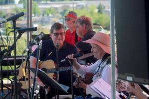 Make Music Project Manager Jan Barber, front right, smiles as she plays with the Marine Hills Folk Jam. Olivia Sullivan/the Mirror