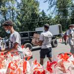 Local youth from Federal Way are the main hands behind each weeks drive-thru food distribution.