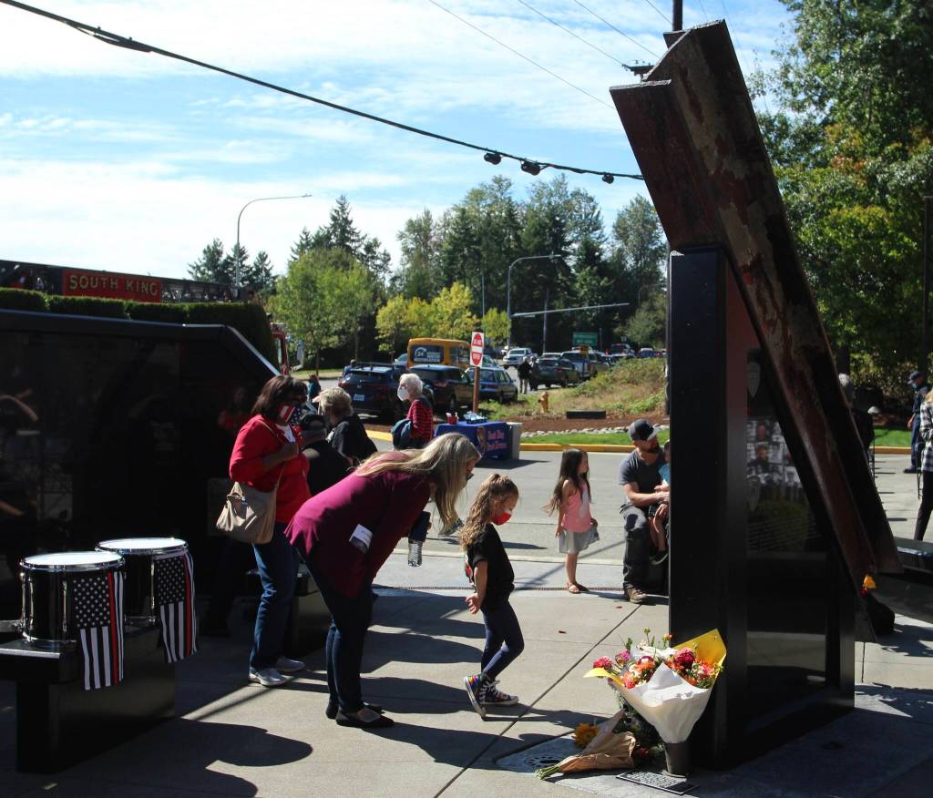 Amber Alvarado tells Luna, 4, the memorial is a special place where we talk about special things. Olivia Sullivan/the Mirror