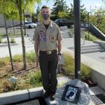Jack Garfield, 17, carved and painted a stone at the veterans memorial to honor Prisoner of War (POW) or Missing in Action (MIA) service members. Olivia Sullivan/the Mirror