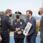 Corporal Charlie Hinckle shakes hands with Attorney General Bob Ferguson while receiving a Medal of Honor on Oct. 8. Photo courtesy of the Federal Way Police Department