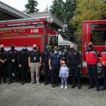 Arianna Graham, center, stands with members of South King Fire & Rescue. Olivia Sullivan/the Mirror