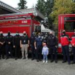 Arianna Graham, center, stands with members of South King Fire & Rescue. Olivia Sullivan/the Mirror