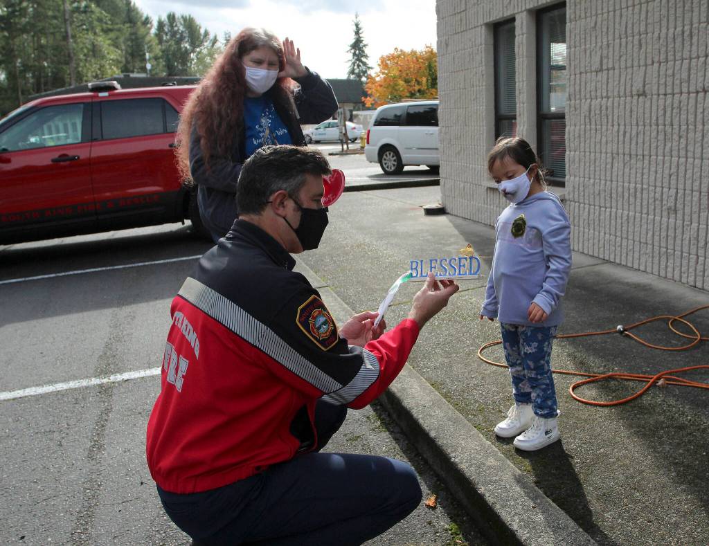 Throughout the year, Andrea and Arianna place signs around Federal Way to spread kindness and promote Down syndrome acceptance. Olivia Sullivan/the Mirror