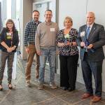 CEO Robin Corak, Dennis Hulses family, and Dan Bogart. Photo by Mel Ponder Photography