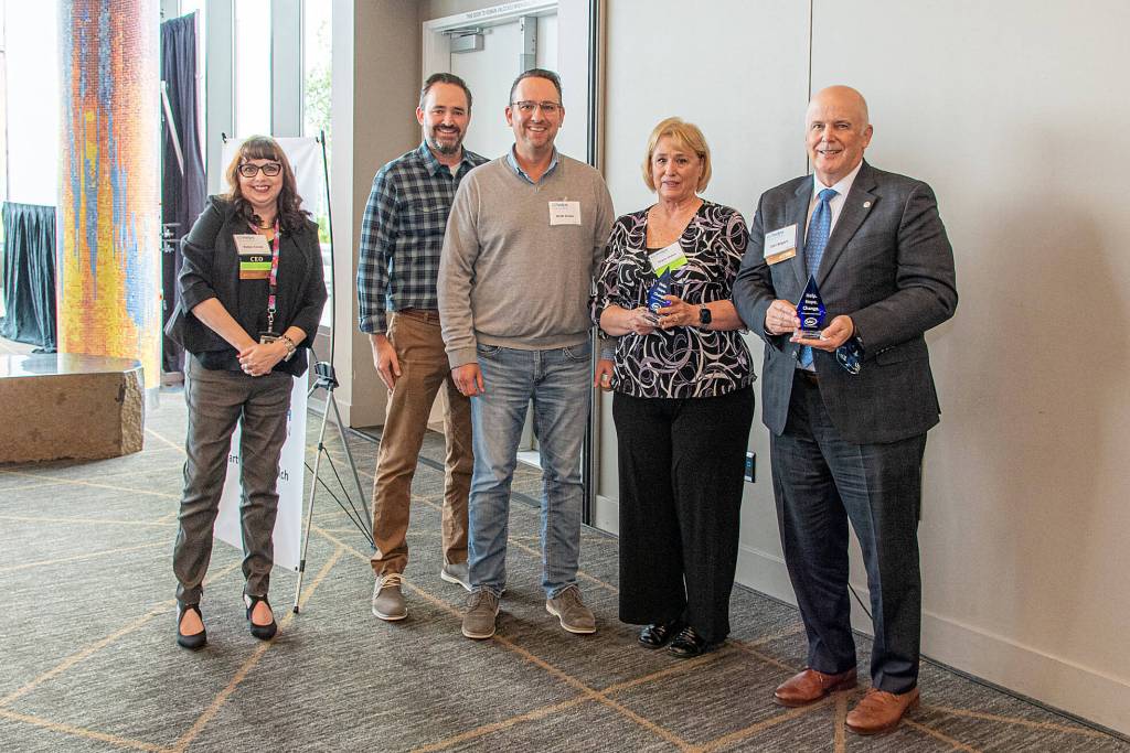 CEO Robin Corak, Dennis Hulses family, and Dan Bogart. Photo by Mel Ponder Photography