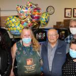 Directors of the Multi-Service Center and Federal Way Food Bank celebrate with Hank Lazzar on Oct. 26. Olivia Sullivan/the Mirror