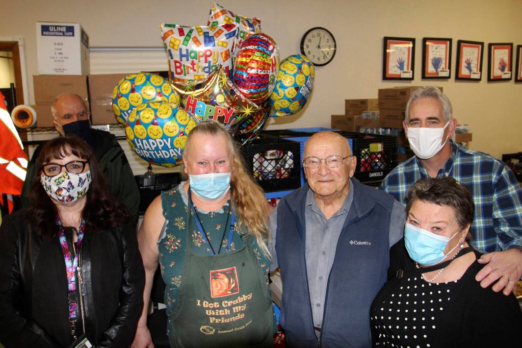 Directors of the Multi-Service Center and Federal Way Food Bank celebrate with Hank Lazzar on Oct. 26. Olivia Sullivan/the Mirror