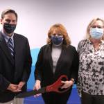 Mayor Jim Ferrell stands with Clinic Director Christine Domschot and Chamber CEO Rebecca Martin at the Caravel Autism Health ribbon cutting and grand opening in Federal Way on Oct. 28. Olivia Sullivan/the Mirror